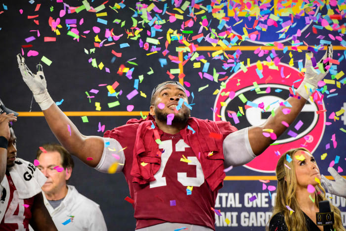 Alabama Crimson Tide offensive lineman Evan Neal (73) celebrates the win over the Cincinnati Bearcats after the 2021 Cotton Bowl college football CFP national semifinal game at AT&T Stadium.